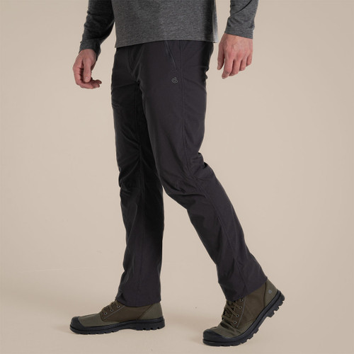 Male model walking in Black Pepper Craghoppers Nosi Pro Trouser III, side view.