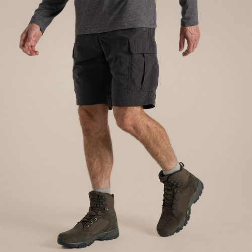 Side view of dark grey Nosilife cargo shorts worn while walking, showing cargo pocket detail.