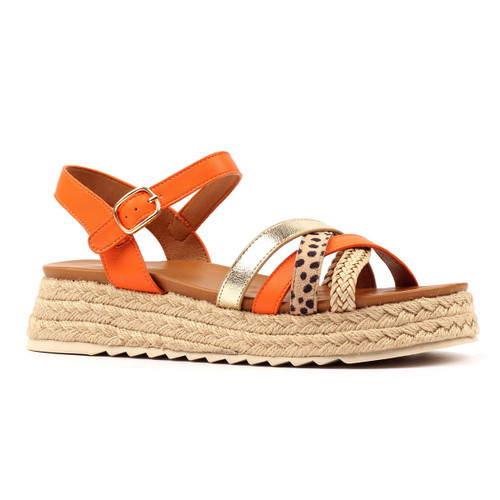 Orange espadrille flatform sandals with a buckle ankle strap, featuring mixed crossover straps in gold, leopard print and woven detailing on a white background.