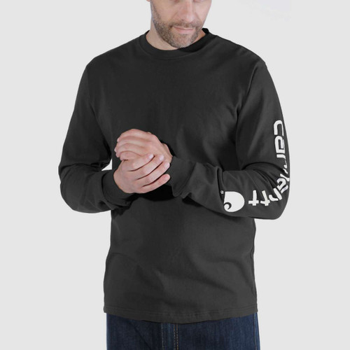 Model wearing a black long-sleeved Carhartt T-shirt with bold Carhartt branding printed down the sleeve.