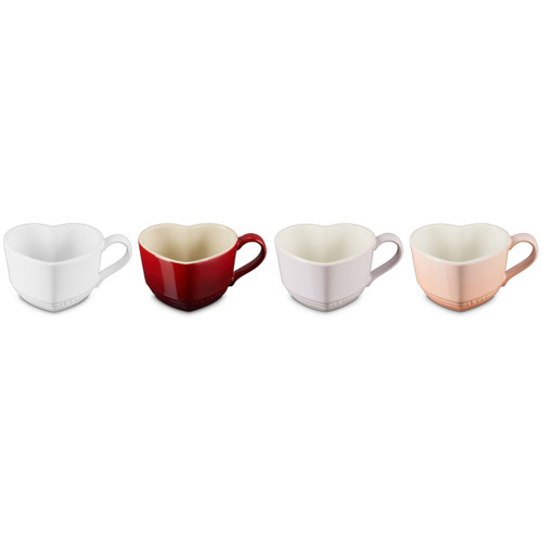 Set of four heart-shaped ceramic mugs in white, red, pale pink and blush, shown from the front on a white background.