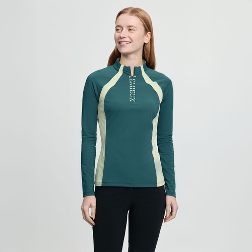Smiling woman wearing a teal and light yellow long-sleeve athletic top with a zip collar and "LEMIEUX" printed on the chest, set against a light gray background.