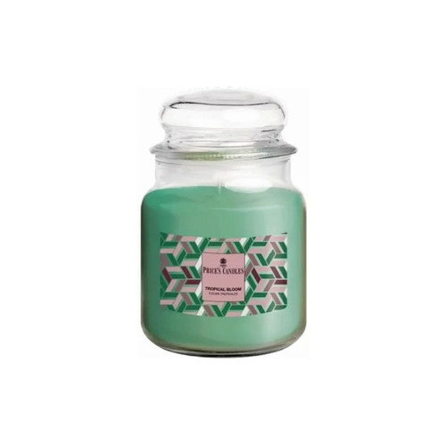 Price’s Candles “Tropical Bloom” scented candle in a medium clear glass jar with lid, featuring a pink label and a geometric chevron pattern in shades of green, pink and grey.