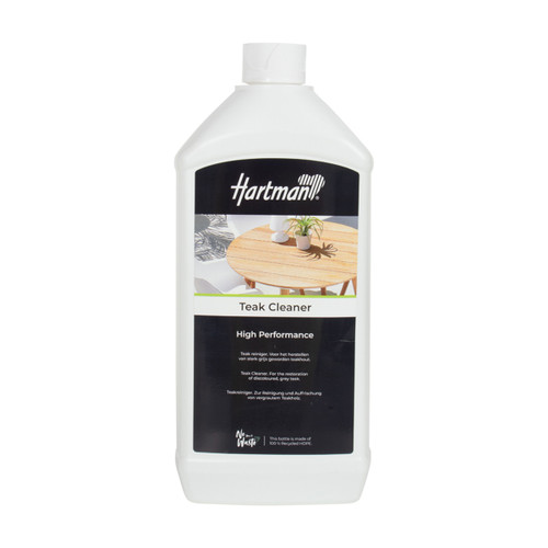 White plastic bottle of Hartman “Teak Cleaner – High Performance” with a black label featuring an image of a wooden outdoor table and plant. The label states it is for restoring discoloured, grey teak and notes the bottle is made from 100% recycled HDPE.