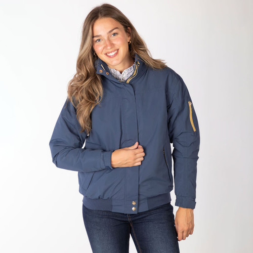 Front view of a model wearing a navy bomber jacket with high collar, styled with a check shirt and jeans.
