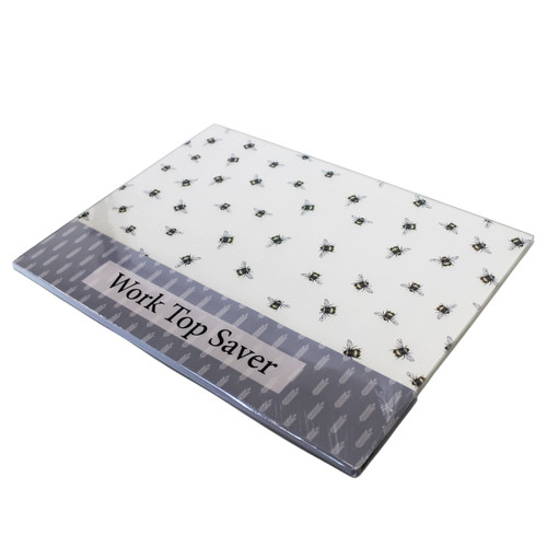 Rectangular worktop saver with a white background and repeating bee pattern, shown in packaging labelled “Work Top Saver”.