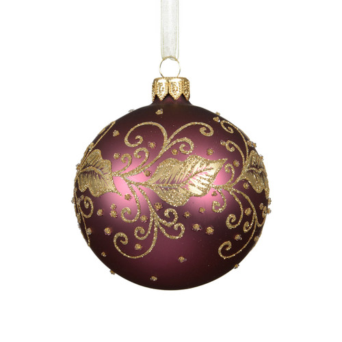 Burgundy glass Christmas bauble with gold glitter leaf and scrollwork pattern, finished with a gold cap and cream ribbon hanger for elegant festive tree decoration.
