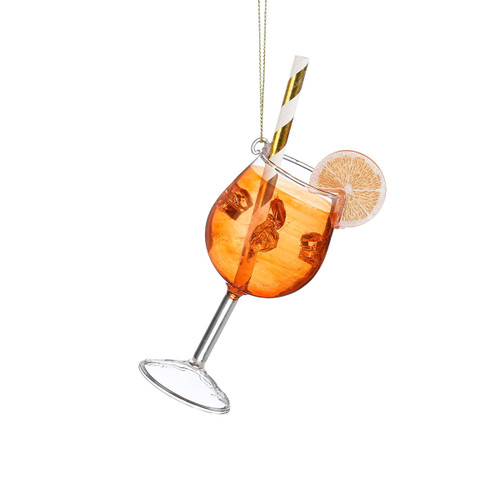 Glass cocktail ornament inspired by an Aperol spritz, featuring an orange-toned drink with ice cubes, a striped straw, and a citrus slice garnish.