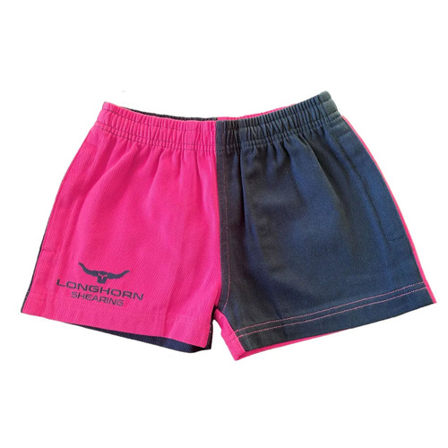 Adult shearing shorts in a bold pink and black colour-block design with an elastic waistband. The left leg is bright pink and features a black "Longhorn Shearing" logo with a longhorn graphic, while the right leg is black. Pink contrast side panels and stitching add detail. Shown laid flat against a white background.