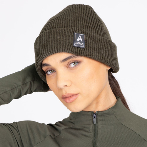 Soft rib knit beanie in versatile khaki with a deep turn-up cuff and signature Aubrion rubber badge for everyday warmth and style.