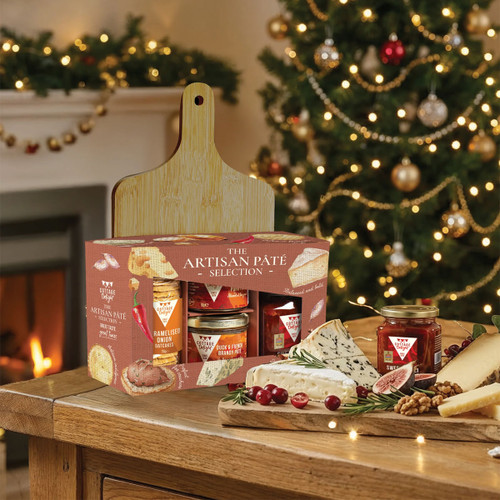 Cottage Delight Artisan Pâté Selection gift set displayed beside a festive cheeseboard, perfect for Christmas entertaining, grazing boards and gourmet food gifts.