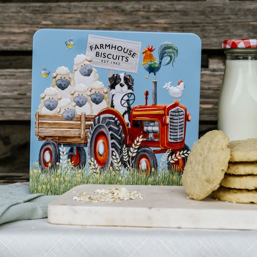 Farmhouse Biscuits gift tin featuring a vintage red tractor with sheep in a trailer, a sheepdog, rooster and hen illustration, containing 280g of luxury biscuits.