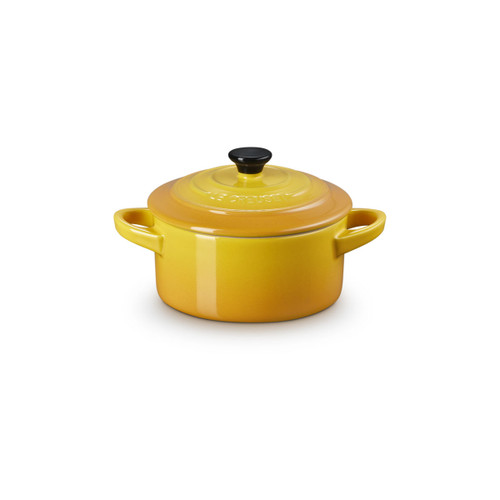 Le Creuset Nectar stoneware mini round casserole dish with lid, shown from the front on a white background.