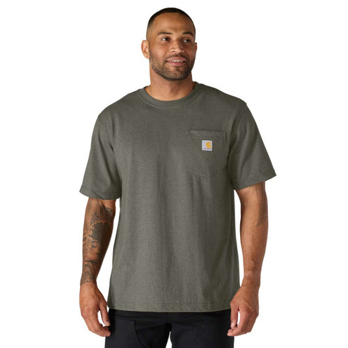 Dark grey-green Carhartt short-sleeve crew-neck T-shirt worn by a model, featuring a chest pocket with signature logo patch.