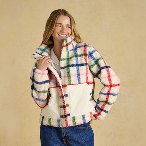 Front view highlighting the high collar, full zip fastening and contrast patch pockets.