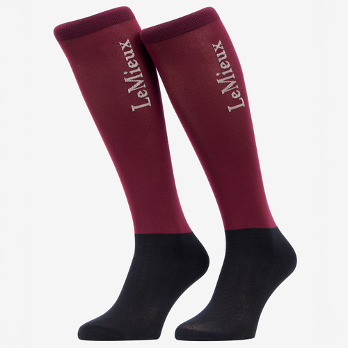 Pair of LeMieux knee-high riding socks in burgundy with navy feet and contrasting LeMieux branding.