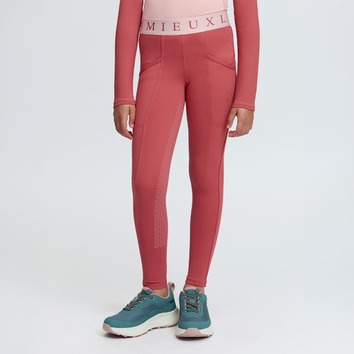 Front view of rose pink LeMieux children’s riding breeches with branded waistband, curved pockets and silicone leg grip detailing.