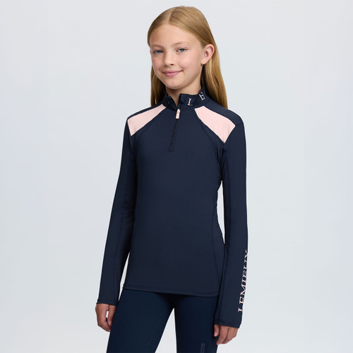 LeMieux children’s long-sleeve riding top in navy with pale pink shoulder panels, quarter zip, branded collar and LeMieux sleeve logo.