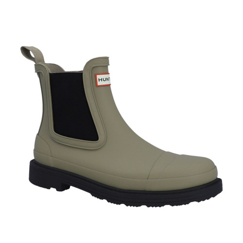 A beige rubber Chelsea boot with a black elastic panel and a black sole.