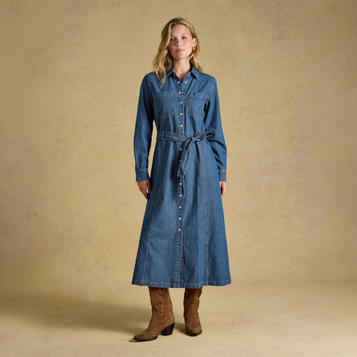 Model wearing a long denim dress with buttons and a belt, paired with brown cowboy boots against a neutral background.