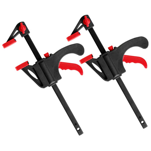 A pair of black and red DEKTON clamps and spreaders with a 4-inch capacity.