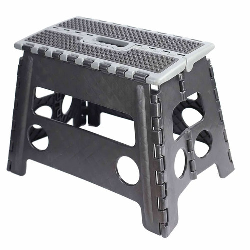 A black folding step stool with a textured top and grey accents, featuring a sturdy design and two side handles.