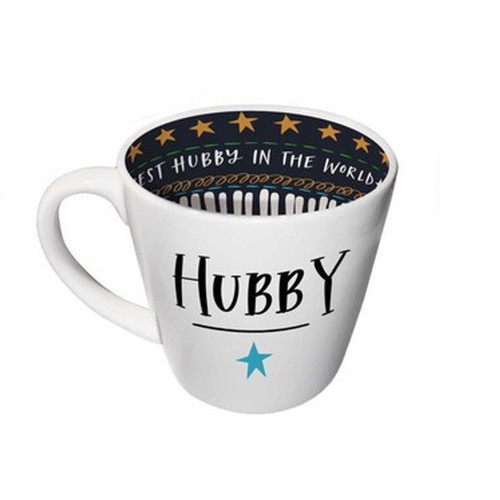 A white ceramic mug with a curved shape and a blue star on the front, featuring a dark interior with gold star patterns.