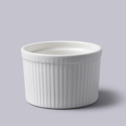 White porcelain 10cm ramekin with a classic ribbed exterior, ideal for baking and serving individual desserts, soufflés and side dishes.