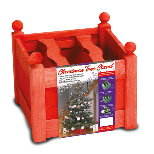 Red wooden Christmas tree stand with integrated water reservoir for real Christmas trees, shown in retail packaging.