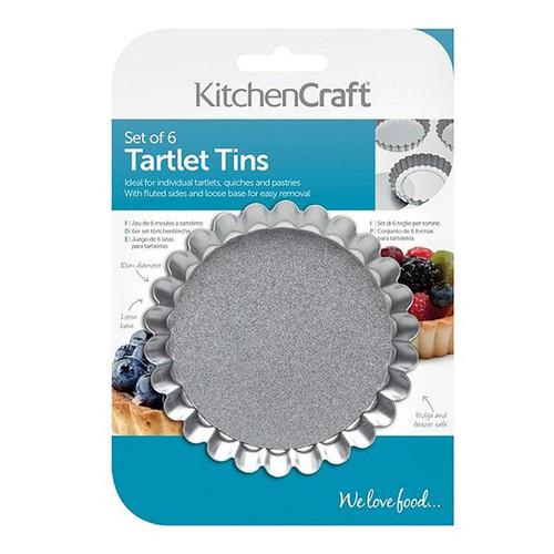 KitchenCraft set of six non-stick tartlet tins with fluted edges and loose bases, ideal for baking individual tarts and quiches.