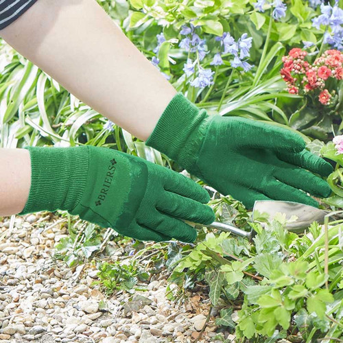 Green gardening gloves with textured rubber grip, shown being used to weed a garden and displayed as a pair on a white background.