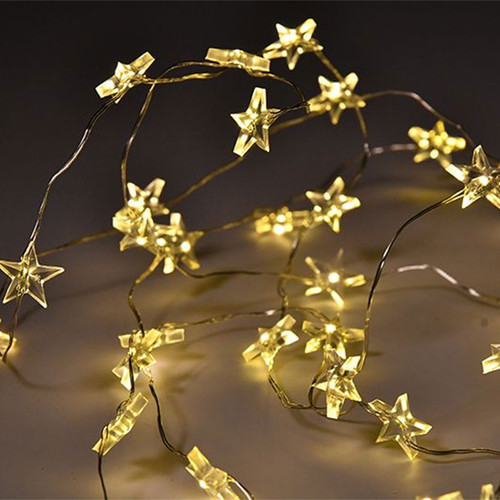 Warm white LED star fairy lights on flexible silver wire, featuring illuminated star-shaped covers for festive Christmas decorations, table displays and seasonal home décor.
