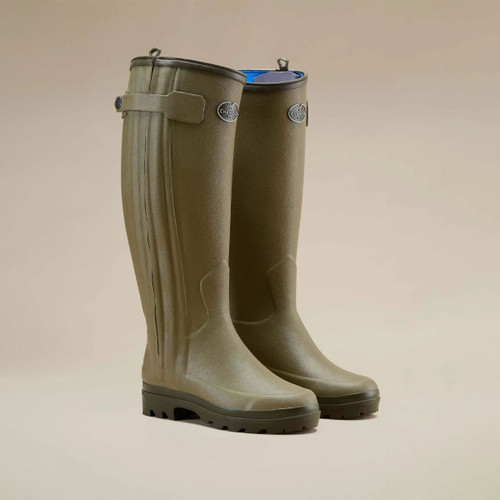 Le Chameau women’s tall olive green rubber wellington boots with adjustable calf straps and rugged outdoor soles.