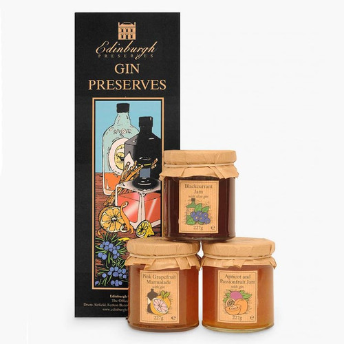 Edinburgh Preserves Gin Preserves gift set with three glass jars of jam in front of a tall illustrated gift box. Flavours include Apricot and Passionfruit Jam, Blackcurrant Jam, and Pink Grapefruit and Mandarin Marmalade.