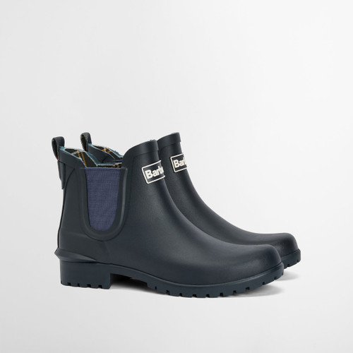Pair of navy Barbour Chelsea-style wellington boots with elastic side panels, photographed on a white background.