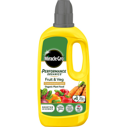 Yellow bottle of Miracle-Gro Performance Organics Fruit & Veg Plant Food with a black cap. The label features vegetables and promotes organic gardening.