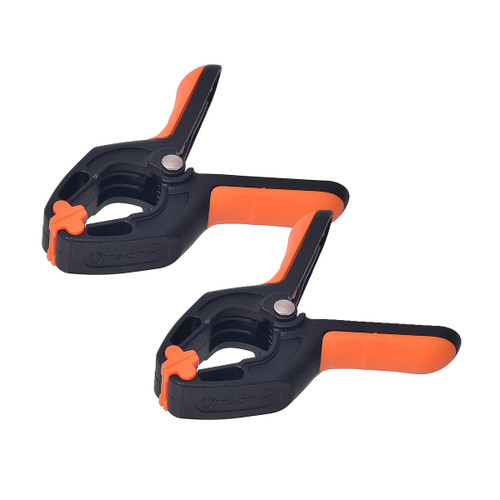 Two black and orange spring clamps with rubber grips are positioned side by side against a white background, suggesting utility and functionality.
