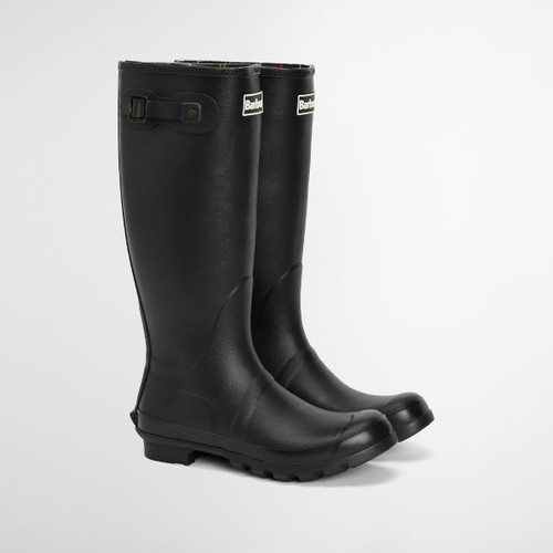 Black Barbour wellington boots photographed on a white background, angled side view showing chunky tread sole.