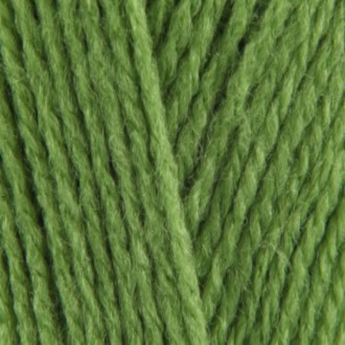 Close-up of tightly twisted green yarn strands arranged diagonally, showing the texture and weave of the wool.