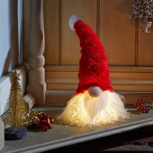A light up gonk head decoration with a red hat and white beard.