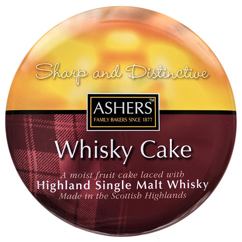 Round cake tin label featuring "Ashers Whisky Cake" in elegant font. Describes it as a moist fruit cake with Highland Single Malt Whisky.