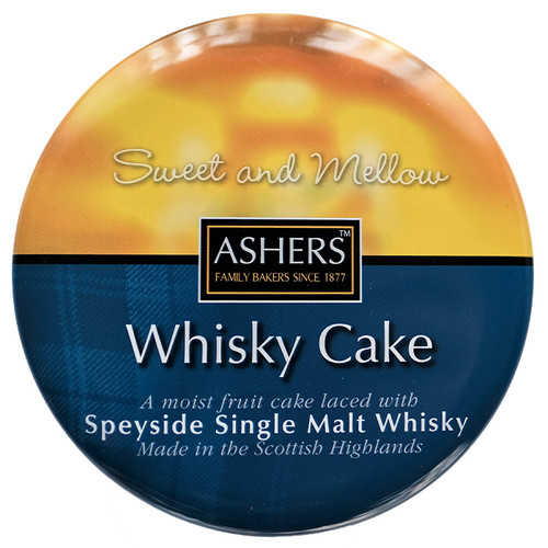 Round tin labelled "Ashers Whisky Cake" with a sunset gradient background. Text describes it as "Sweet and Mellow" with Speyside Single Malt Whisky.