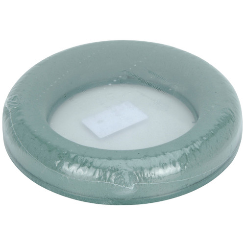 Round green floral foam wreath ring wrapped in protective plastic, ideal for creating fresh flower arrangements, seasonal wreaths and festive table centrepieces.