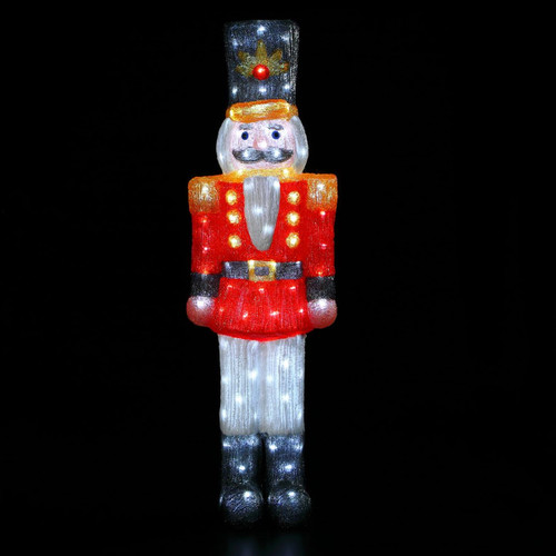 A lit Nutcracker on a black background