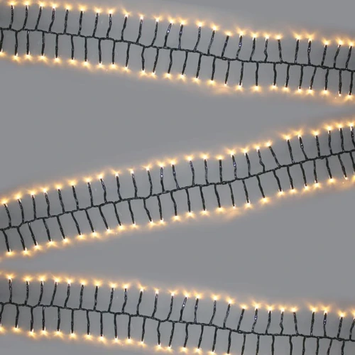 Warm white cluster Christmas tree lights with densely packed LEDs on a green cable, creating a bright and elegant festive display for indoor and outdoor use.