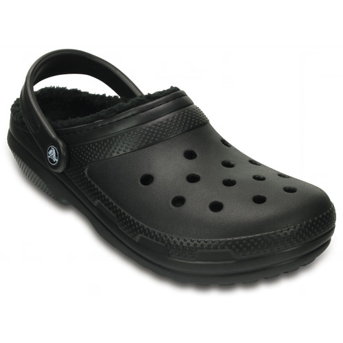 A black clog with a perforated upper, textured outsole, and adjustable heel strap. It has a cosy fleece lining, conveying comfort and casual style.