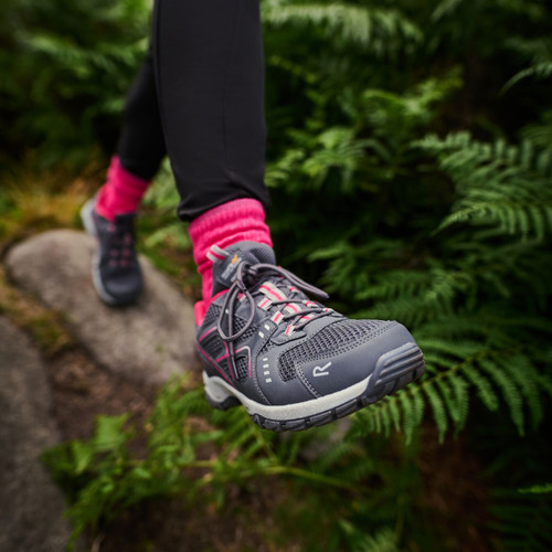 A person wearing granite coloured walking shoes