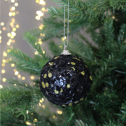 Black and Gold Sequinned Bauble on a Christmas tree