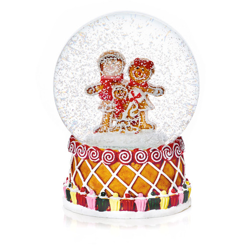 A decorated gingerbread snow globe with a gingerbread family and snow floating around.