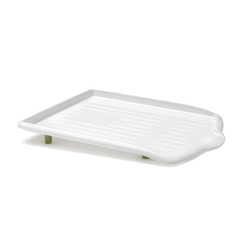 White plastic sink drainer tray with raised ridges and non-slip feet, compact kitchen dish drying rack accessory for draining plates and glasses